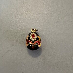 Elegant Black and Gold Enameled Egg Pendant